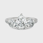 Load and play video in Gallery viewer, Trinity Pear Cut &amp; Round Cut Three Solitaire Diamond Ring (1.50 CT. Pear Cut)
